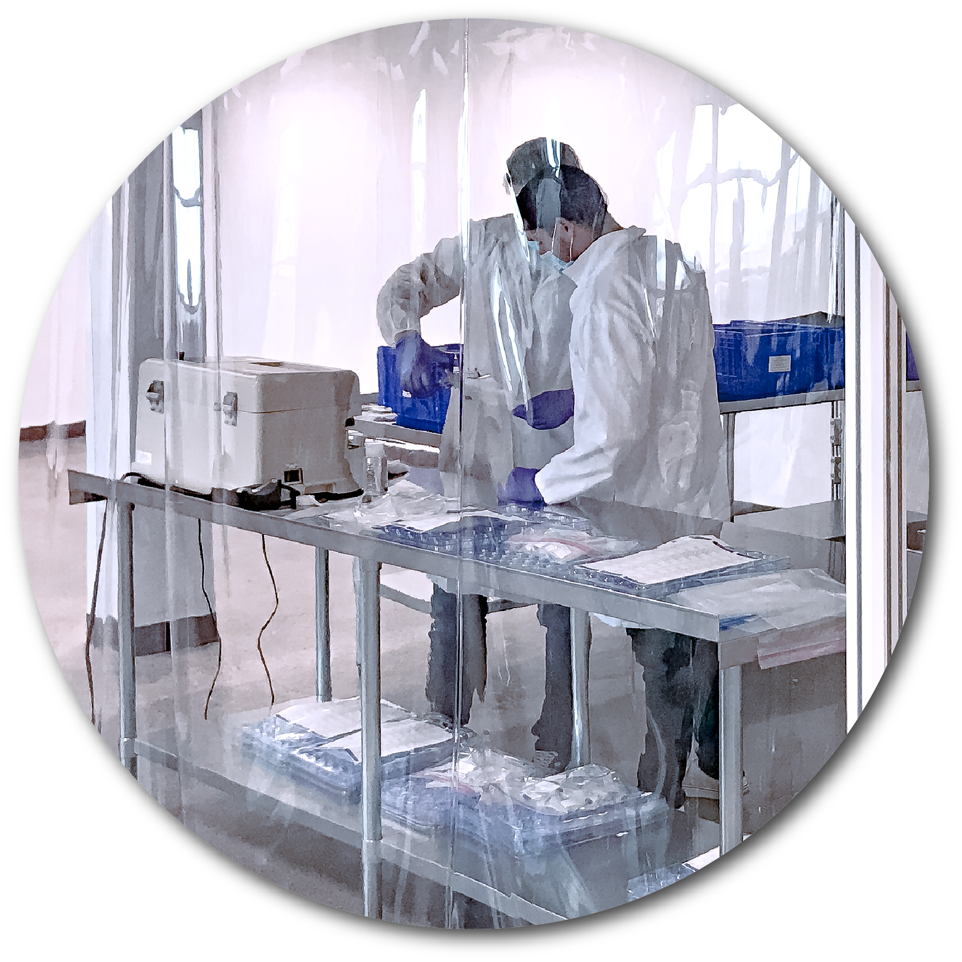 two men assembling a product in clean room bubble